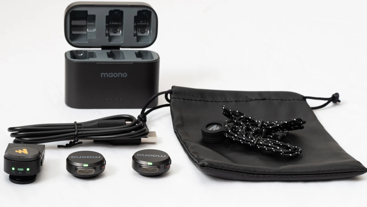 Maono wireless microphone system with charging case, transmitters, receiver, USB cable, and drawstring storage pouch.