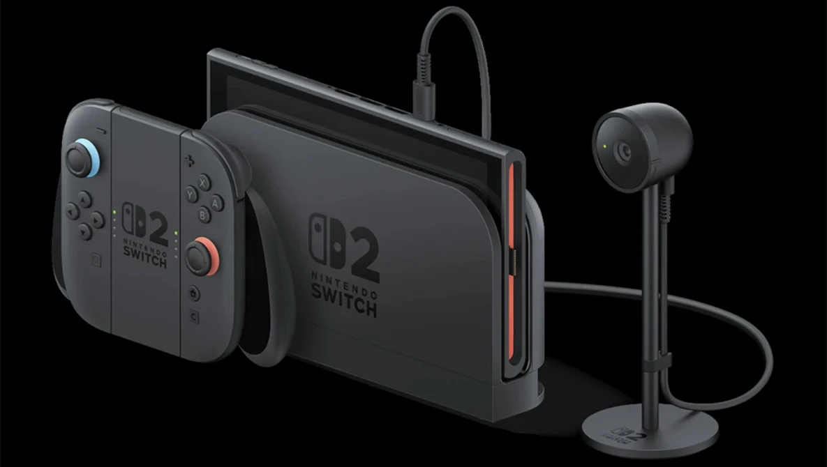 Product photograph of gaming console with detached controllers and wireless headset displayed against black background.