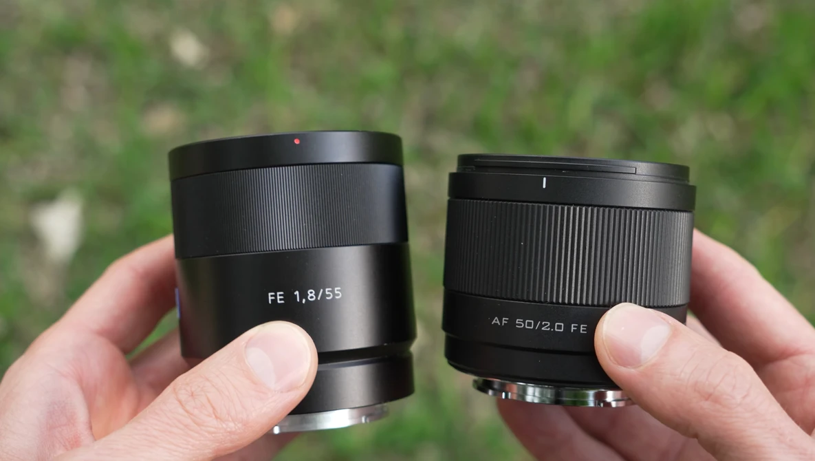 Two Sony prime lenses held side by side: FE 1.8/55 and AF 50/2.0 FE, showing barrel designs and aperture markings.