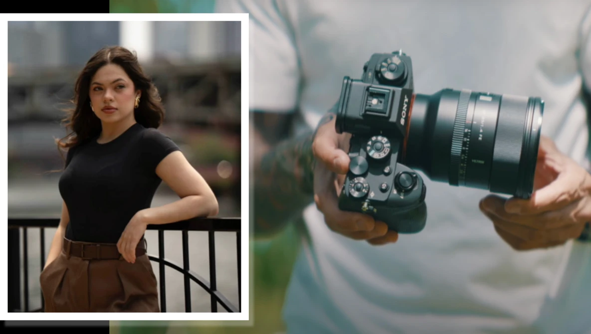 Portrait of a woman in black top and brown skirt standing against an urban railing; detail of hands holding a mirrorless camera with telephoto lens.