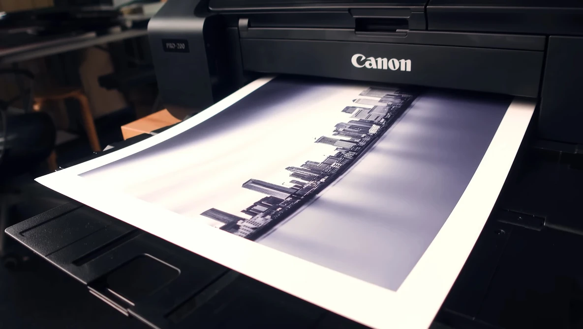Canon printer outputting a black and white contact sheet of film negatives.