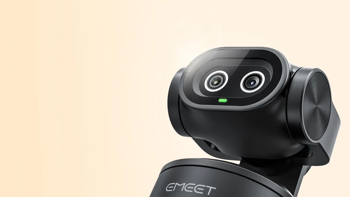 EMET robotic camera head with dual wide-angle lenses mounted on support base against cream background.