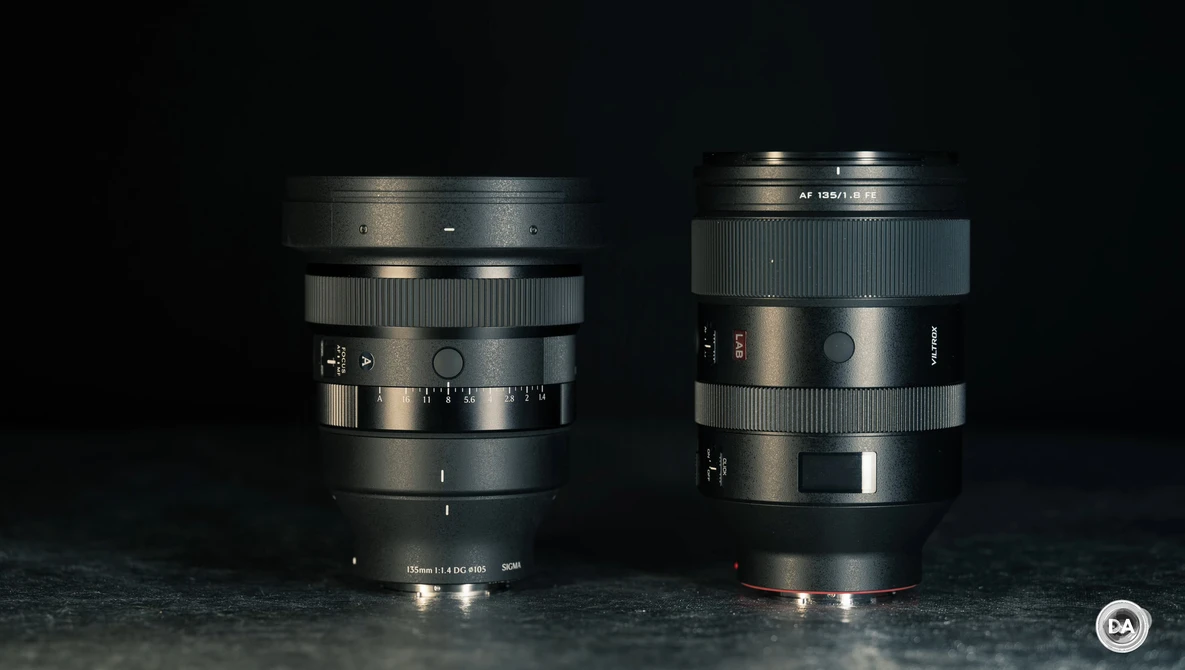 Two vintage camera lenses displayed side by side against a dark background.