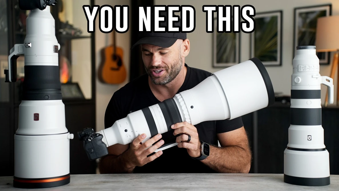 Man holding and comparing two white telephoto lenses with black accent bands at a table.