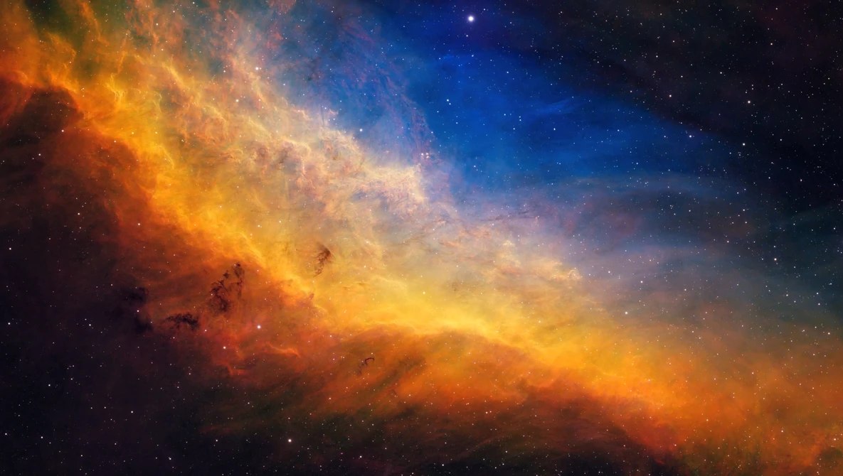 Nebula with fiery orange and golden clouds transitioning to deep blue, dotted with stars.