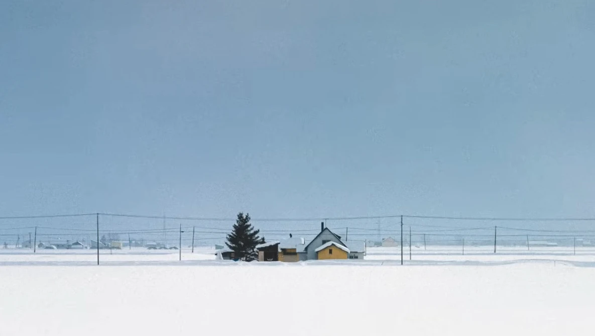 Isolated farmhouse with evergreen trees in snowy field under clear blue sky.