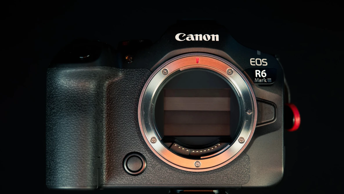 Canon EOS R6 Mark II mirrorless camera body with open sensor and orange lens mount ring visible.