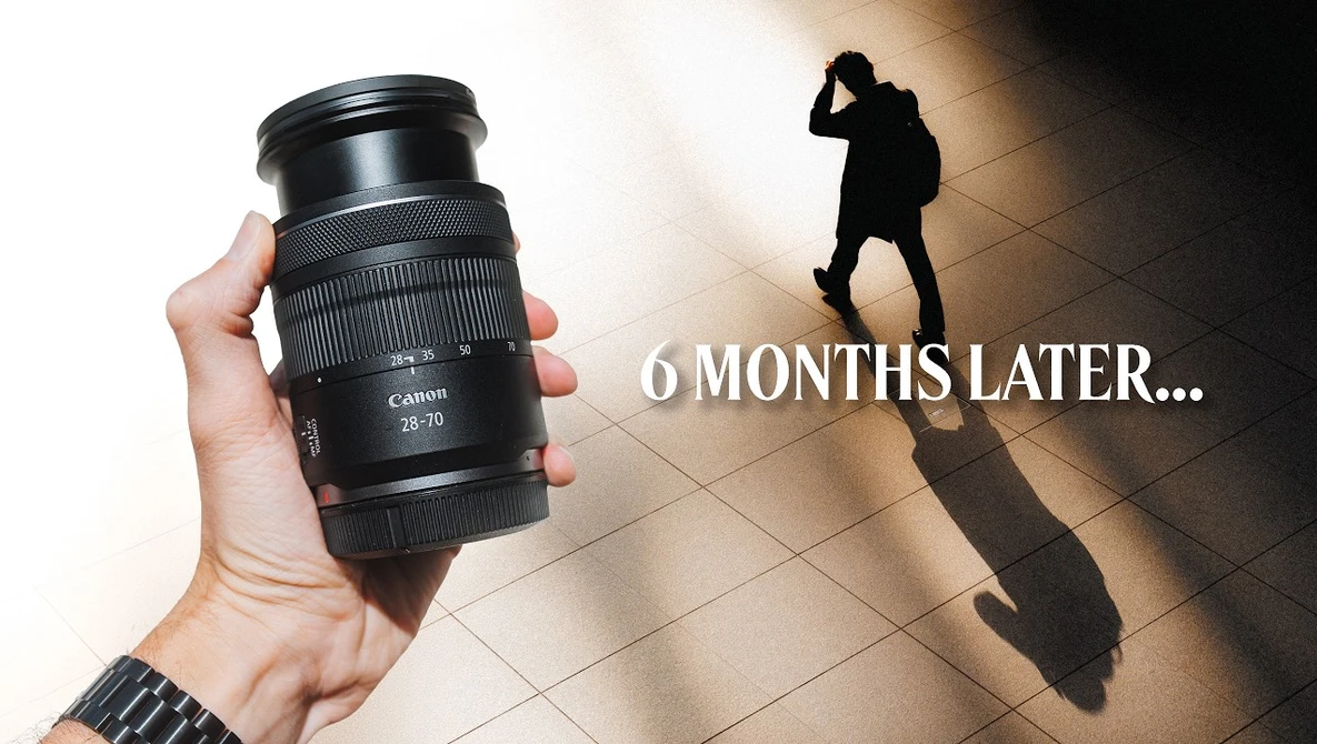Hand holding a Canon 28-70mm lens with silhouette of photographer below and text reading "6 MONTHS LATER...".