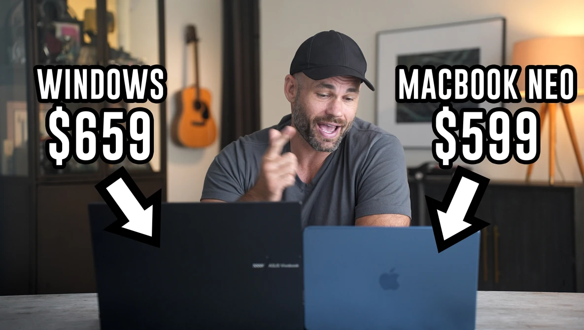 Man comparing a Windows laptop and MacBook Neo side by side, with price labels displayed.