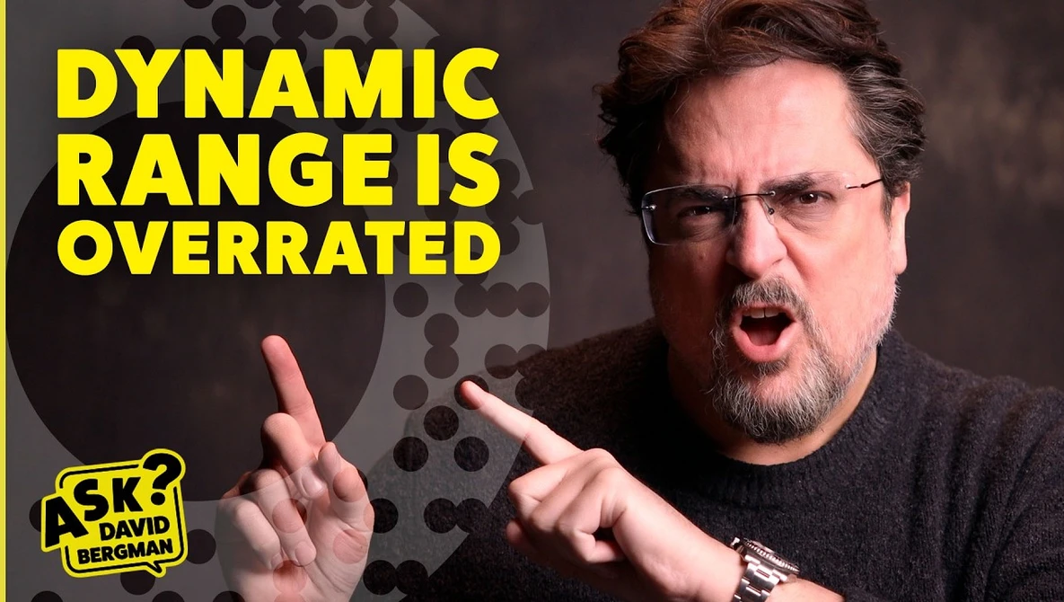 Man with glasses gesturing while speaking, with yellow text reading "Dynamic Range is Overrated."