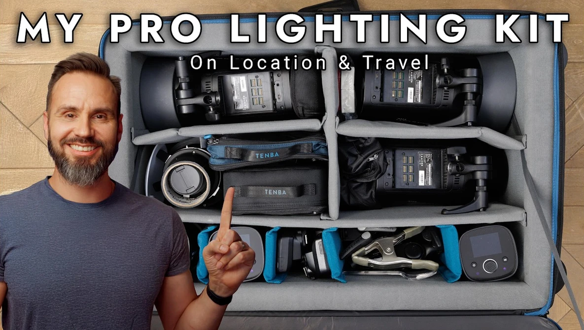 Professional lighting kit organized in a foam-lined case with flash units, light stands, and accessories neatly arranged in compartments.