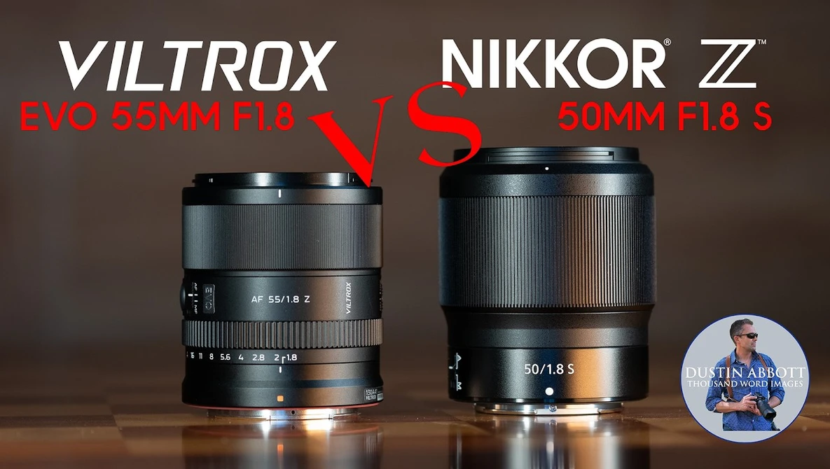 Viltrox Evo 55mm f/1.8 lens positioned beside Nikkor Z 50mm f/1.8 S lens on wooden surface.
