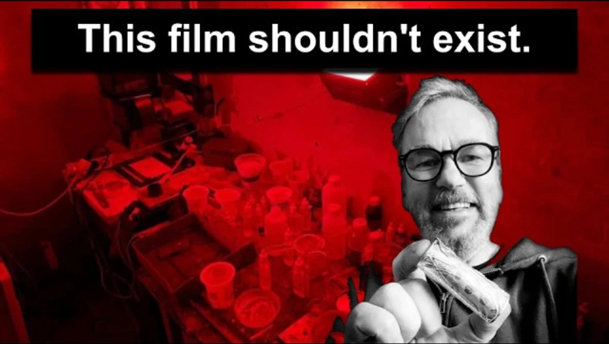 Graphic design with man in glasses against red background with text overlay