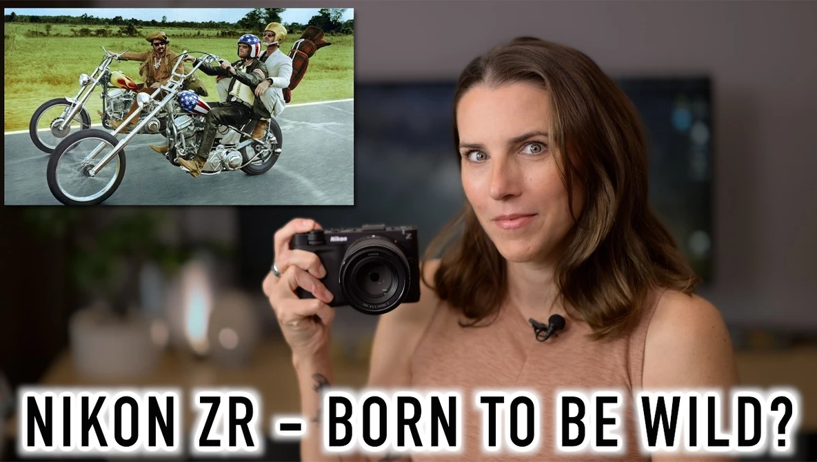 Woman holding Nikon ZR camera with inset image of motorcycle stunts