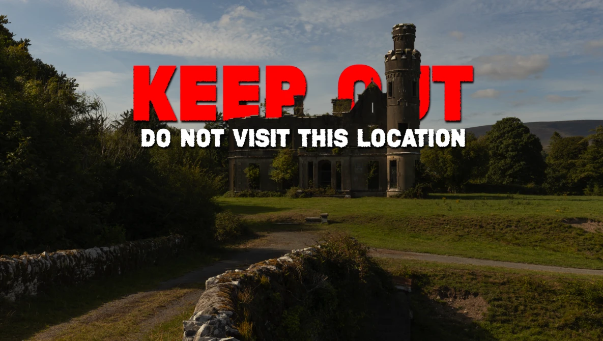 Abandoned stone mansion with warning text overlay reading 'KEEP OUT DO NOT VISIT THIS LOCATION'