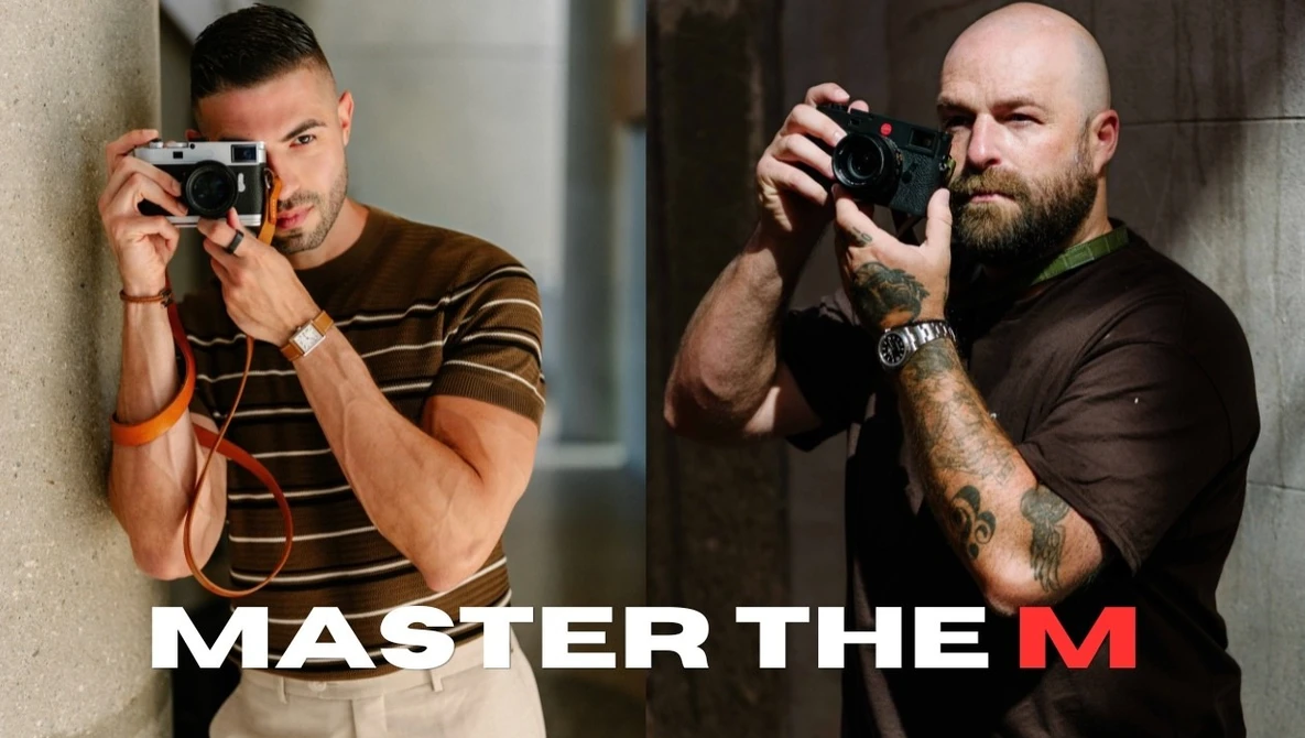 Two male photographers holding cameras in different shooting positions against concrete walls