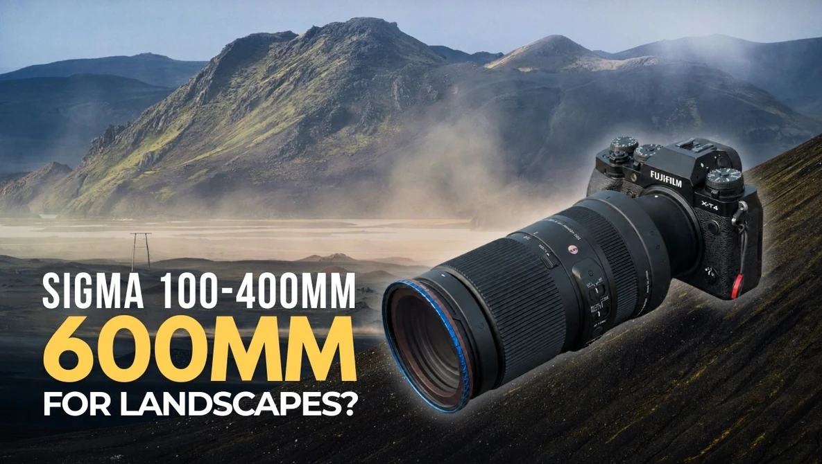 Nikon camera with Sigma 100-400mm lens positioned on mountainous landscape with volcanic peaks and mist