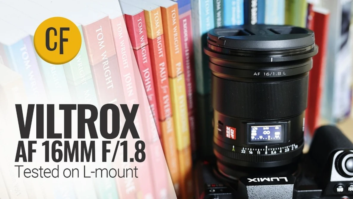 Viltrox AF 16mm f/1.8 lens positioned in front of colorful book spines