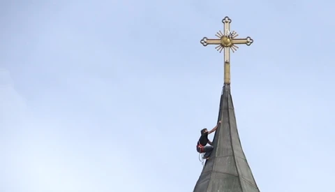 Rock Climber Scales Church To Retrieve Stuck Camera Drone