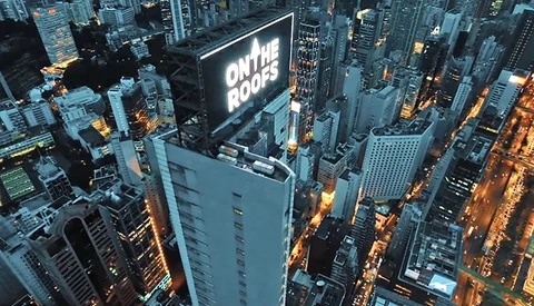 On Roof Tops Crew Hijack Sign in the Heart of Hong Kong