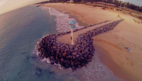 Photographer Ryan Chatfield Sprints Beach, Climbs Rocks, to Save Drone from Waves Below