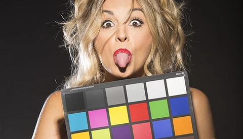 Model making funny face with color chart