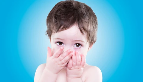 toddler blowing a kiss
