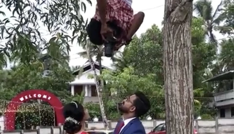 This Wedding Photographer Will Do Anything to Get the Shot