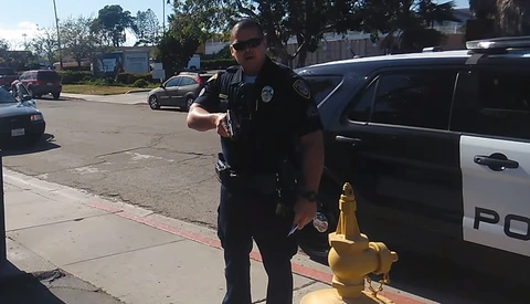 Police Officer on Leave After Pointing Gun at Videographer: Two Sides of the Story