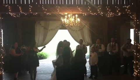 Wedding Photographer Shoves Stepmom With Phone out of the Way to Shoot First Kiss