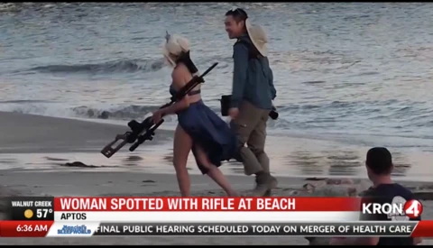 Photographer and Model Spotted Using Huge Fake Rifle in Public Beach Photoshoot