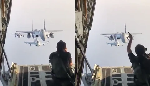 Daredevil Photographer Sits on Cargo Door to Take Pictures of Jets Flying Directly Behind Him