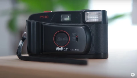 Vivitar PS-10 35mm point-and-shoot film camera with focus-free lens and built-in flash.
