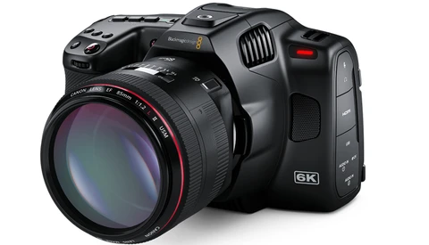 Blackmagic Pocket Cinema Camera 6K with Canon lens mounted, shown at three-quarter angle against white background.