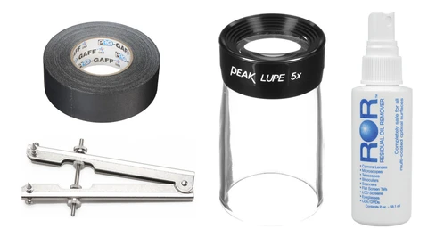 Four filmmaking and lighting accessories arranged on white background: gaffer tape roll, magnifying loupe, lighting arm with knuckles, and spray bottle.