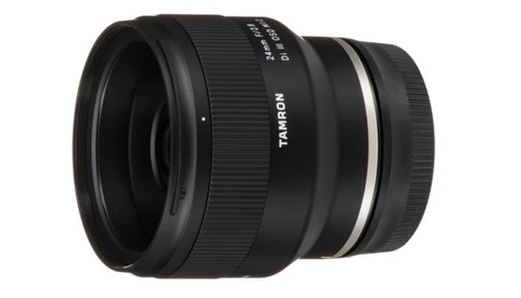 Tamron wide-angle prime lens with black barrel and white accent ring.