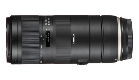 Tamron telephoto zoom lens with extended barrel and focus ring against white background.