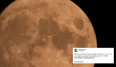 Full moon photograph showing detailed crater formations and lunar surface texture in warm tones.