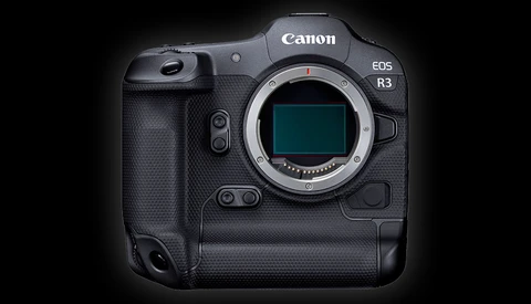 Canon EOS R3 mirrorless camera body with open mirror box and sensor visible against black background.