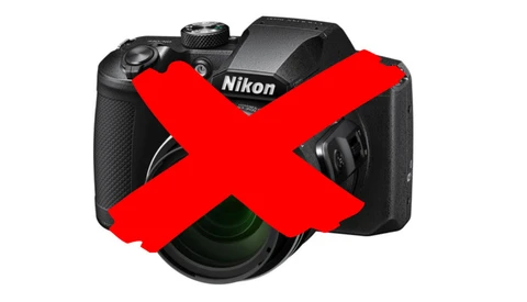 Nikon digital camera with a large red X overlaid across it.