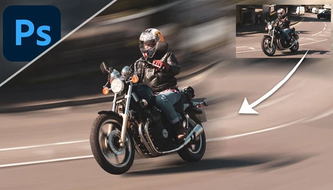 Motorcyclist leaning into a turn on a curved road with motion blur effect.