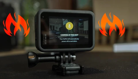 Action camera displaying thermal warning message with animated flame graphics on either side.
