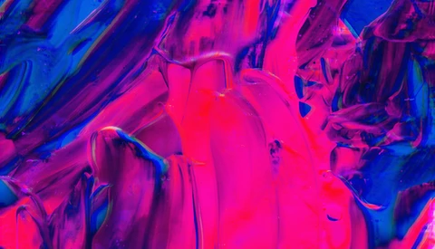 Abstract fluid art with vibrant magenta and electric blue swirling patterns and textures.