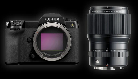 Fujifilm GFX 100S medium format camera body with Fujinon 110mm f/2 lens against black background.