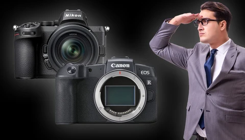 Nikon Z9 and Canon EOS R mirrorless cameras displayed with a man in business attire.