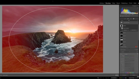 Screenshot of photo editing software showing a coastal landscape with warm red color grading and an oval crop overlay.