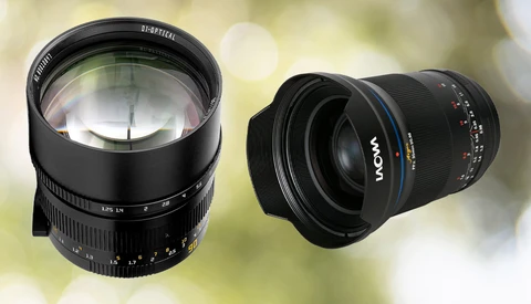Two prime camera lenses displayed against a blurred green and white bokeh background.