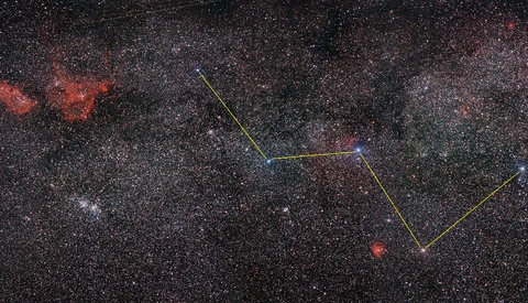 Star field with constellation overlay and colored geometric lines marking star positions.