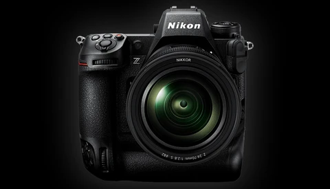 Nikon Z mirrorless camera with attached zoom lens against dark background.
