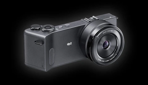 The Sigma dp2 compact digital camera with fixed lens mounted on black background.